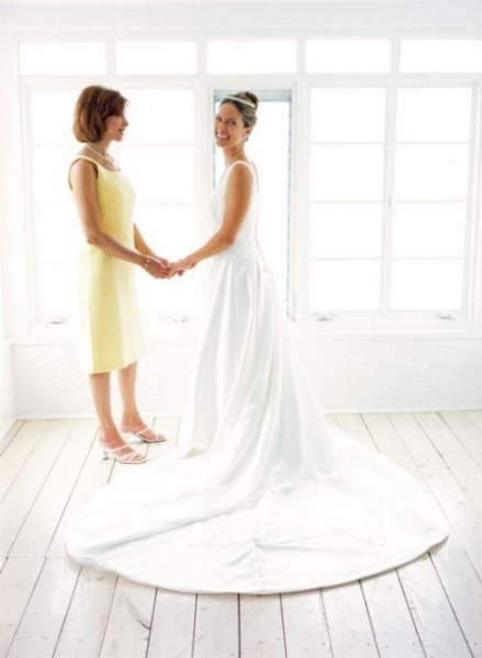 bride ready for her big day with her mom