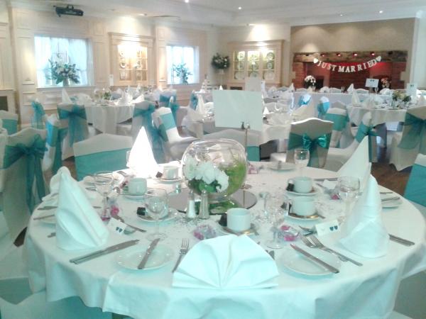 chair covers with teal wedding scheme