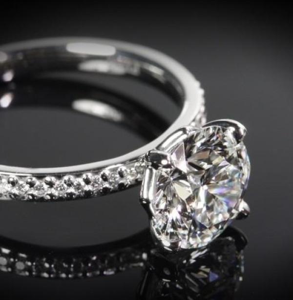 Round Engagement Ring With Diamond Shoulders.
