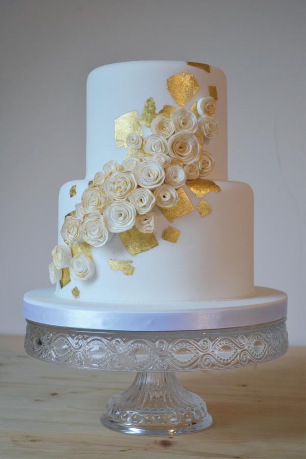 gold leaf and white ruffle flower wedding cake