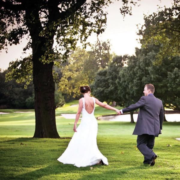bride and groom on the golf course