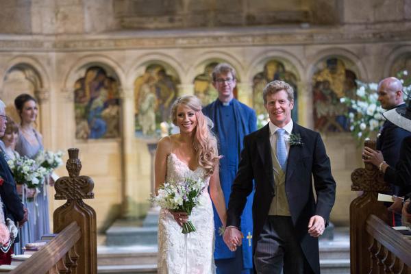 Bride and groom leave the church