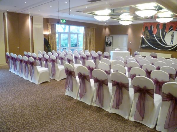 white lycra covers and purple sashes