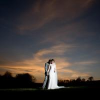 Bride and groom with Sunset