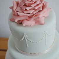 pastel colour wedding cake with sugar rose