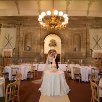 The Great Hall with its striking interior detials including stone columns, a classic compartmental ceiling and period chandeliers, is an ideal blank canvas for your wedding 