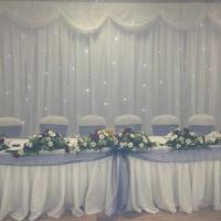 head table with sparkly backdrop
