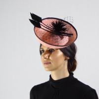 Apricot and black saucer fascinator with black quills
