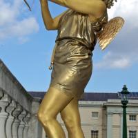 Golden Cupid human statue