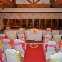 lycra chair covers - pink, orange & green wedding scheme