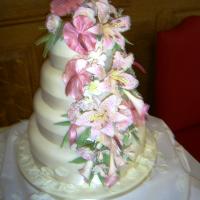 Ivory stacked with handmade sugar flower cascade.